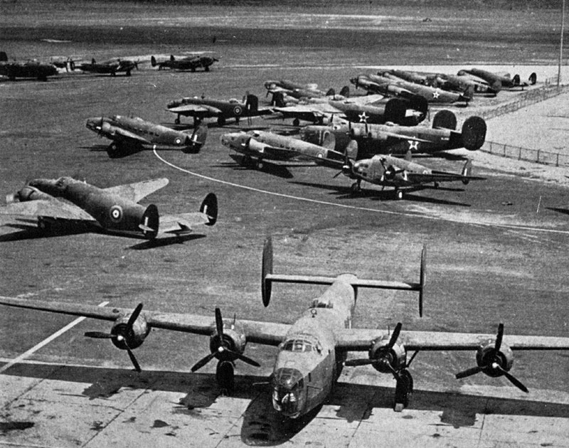Photo: Aircraft at Dorval Airport awaiting delivery, a line of Hudsons behind the B-24 Lib parked in the front.